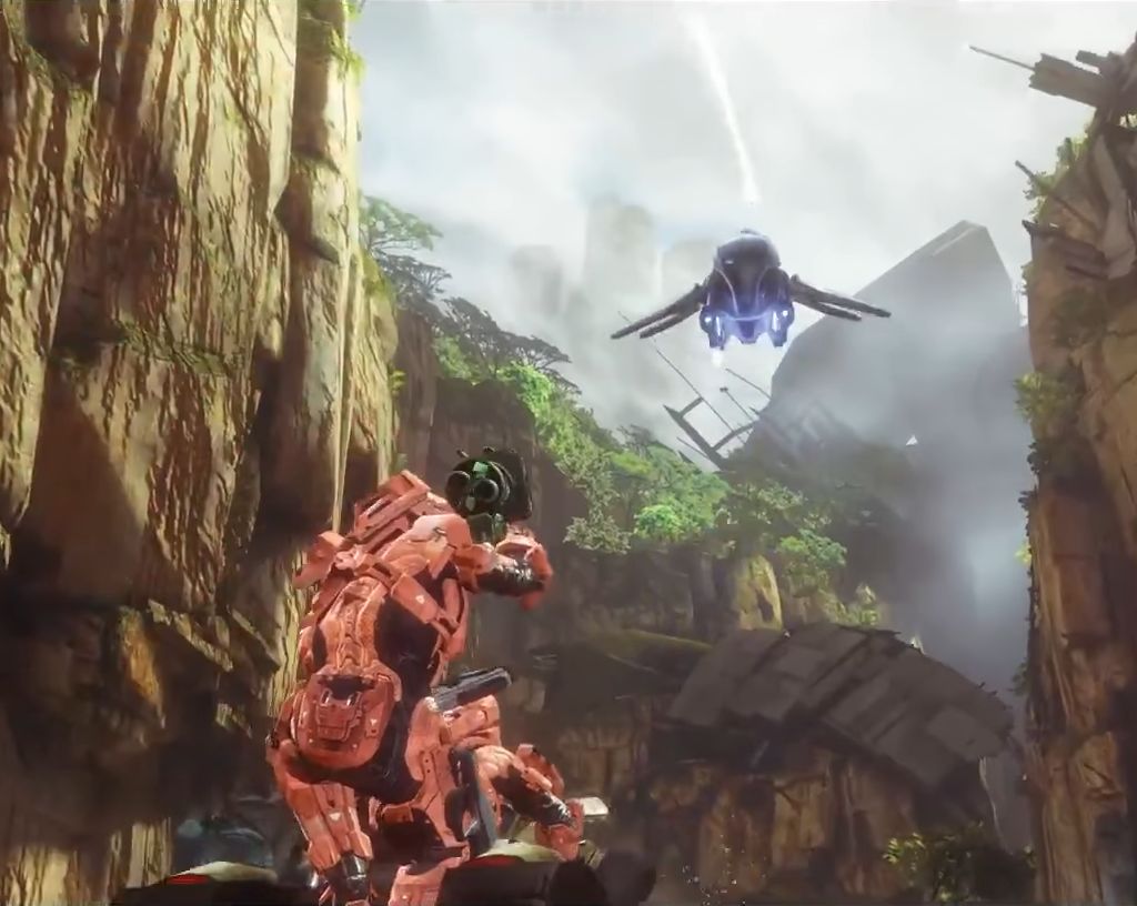 Screenshot of Halo 4 multiplayer gameplay featuring a red-armored character aiming a weapon in a canyon-like environment with a hovering vehicle overhead.
